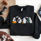 Black sweatshirt with Halloween-themed design of ghosts and pumpkins on a white surface.