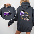 a woman wearing a grey hoodie showcasing the front and back with Indie Fusion bookcon logos on both sides. They include purple flowers and birds