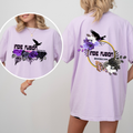 A model wears an oversized light lavender t-shirt showing both the front and back designs. The front features a graphic of purple and black roses with a crow and the text 'INDIE FUSION BOOKCON'.